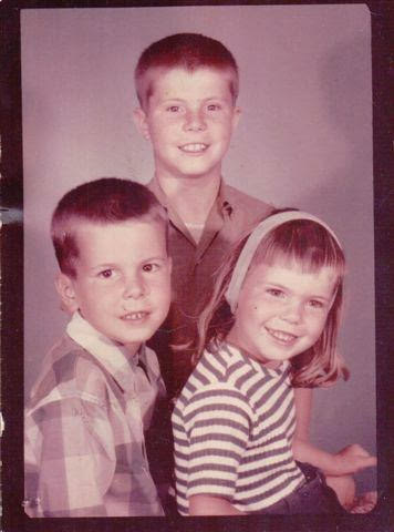 My brothers and me: I had received a beating right before this picture because I cut my bangs